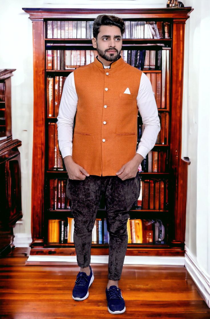 Add a touch of timeless elegance to your wardrobe with our exquisite Jute Orange Nehru Jacket. Handcrafted with precision and care, this jacket is a perfect blend of traditional style and modern sophistication. Crafted from high-quality jute fabric, this Nehru jacket offers a unique texture that sets it apart from conventional options. The natural earthy tones of jute are complemented by intricate detailing, making it a versatile piece that can be dressed up or down for various occasions. The minimalist yet captivating design features a mandarin collar that exudes refined class. The front placket with carefully selected buttons adds an element of charm and functionality. Whether you're attending a formal event, a cultural celebration, or simply want to elevate your everyday style, this Jut Traditional Winter Bandhgala For Workwear, Fall Festive Nehru Jacket, Traditional Semi-formal Winter Outerwear, Traditional Nehru Jacket With Stand Collar For Work, Traditional Fitted Nehru Jacket For Fall, Festive Nehru Jacket For Workwear, Classic Nehru Jacket With Stand Collar For Festive Occasions, Festive Classic Nehru Jacket With Stand Collar, Traditional Festive Nehru Jacket For Workwear