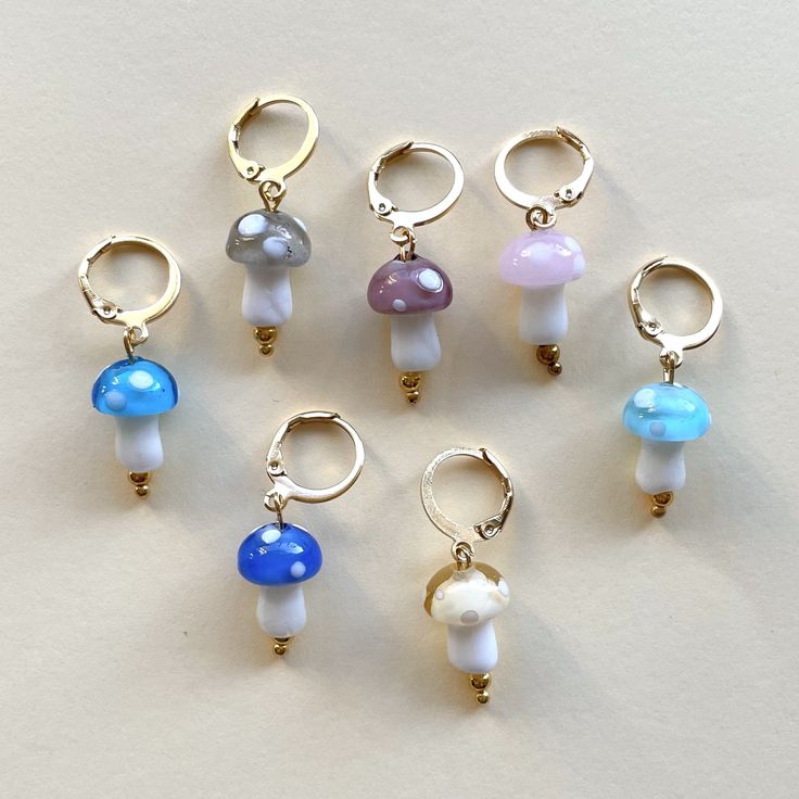 six pairs of earrings with different colored beads