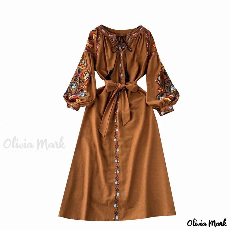 Olivia Mark - Luxurious Long-Sleeved Evening Dress with Enchanting Floral Accents Festive Long Sleeve Folk Dress, Folk Style Tunic Dress For Fall, Peasant Style Brown Dresses For Fall, Brown Peasant Dress For Fall, Festive Long Sleeve Embroidered Midi Dress, Folk Style Fall Festival Dresses, Traditional Long Sleeve Midi Dress For Spring, Peasant Style Embroidered Dress For Fall, Brown Long Sleeve Traditional Dress