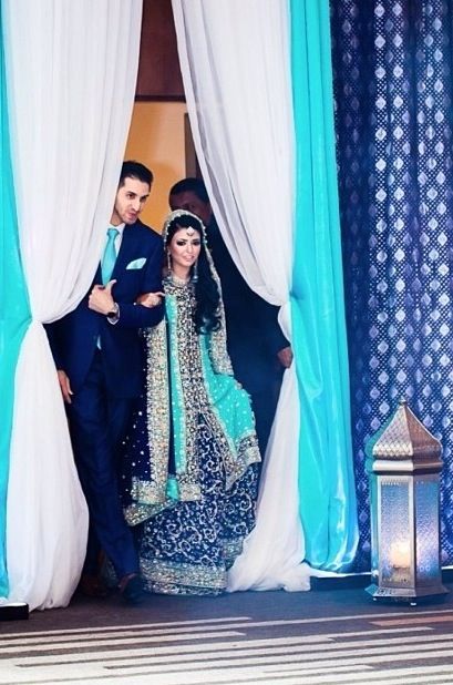 a man and woman standing in front of curtains with the caption'a woman's lovable test when her man has nothing to laugh about