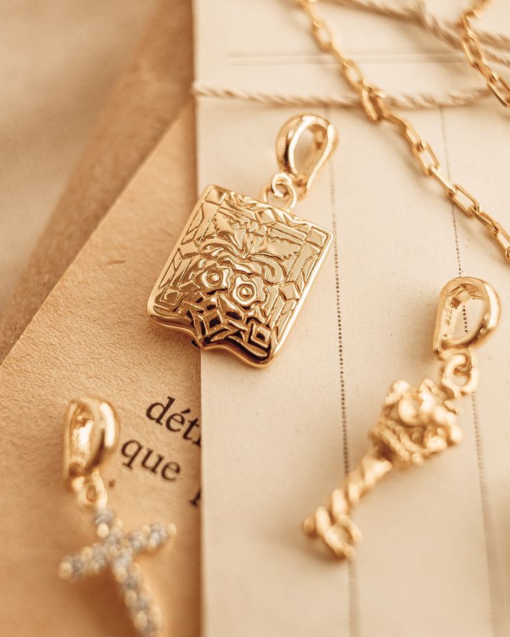 The Shield Talisman Charm, this beautiful floral engraved pendant, vintage-esque designs. Perfect to to add to your favorite necklace. This beautiful shield is gold plated silver. The bail is gold plated silver and removable. Length 1.5 inch (Shield pendant Only) All items come in a gift box ready to gift. To see more please visit https://www.etsy.com/shop/BijouLimon Bijou Limon jewelry collections present a romantic French spin on the latest jewelry trends. Based on the US West Coast but French Amulet Charm, Latest Jewellery Trends, Engraved Pendant, The Shield, Vermeil Jewelry, Key Pendant, Lucky Charm, Gold Plated Silver, Accessories Unique