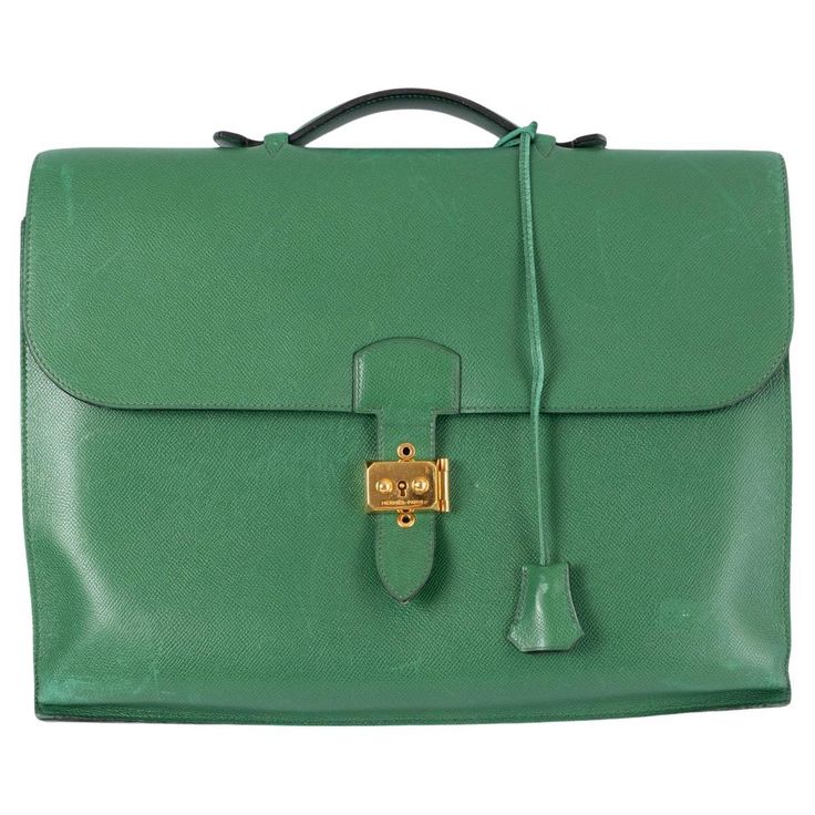 100% authentic Hermès Sac a Depeches 2-38 briefcase in Vert Claire green Veau Courchevel leather featuring gold-plated flip-lock buckle. Interior is unlined and has two main compartments and a big flat pocket on front under the flap. Vintage - has been carried often and shows some dents and wear allover especially to the corners. Comes with dust bag, clochette and keys. Measurements Height 30cm (11.7in) Width 38cm (14.8in) Depth 12.5cm (4.9in) Hardware Gold-Tone Blindstamp U in a Circle (1991) A Vintage Briefcase, Bags Ideas, Briefcase Bag, Chanel Camellia, Mens Travel, Mens Travel Bag, Kelly Bag, Gold Top, Business Bag