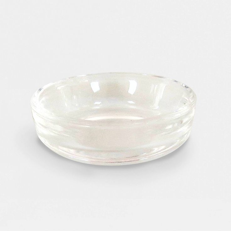 a clear glass bowl on a white background