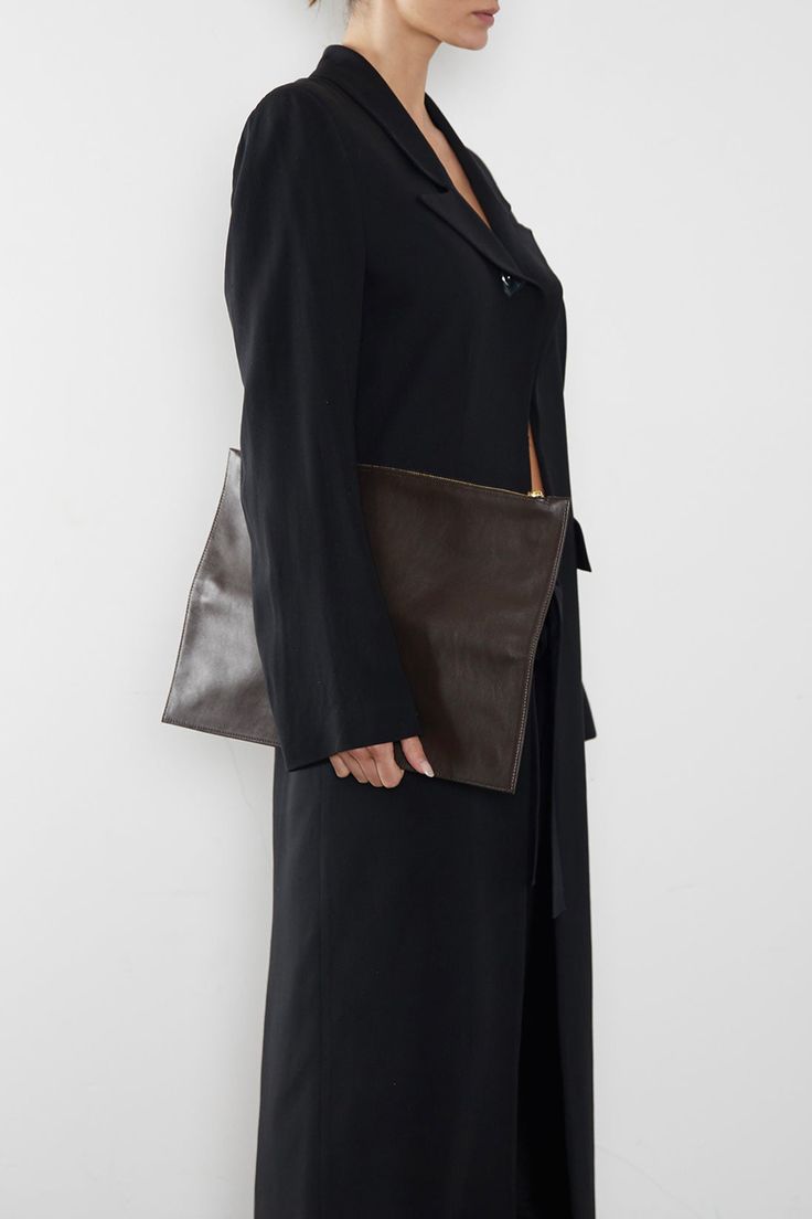 The Slimline in smooth dark brown is the ultimate clutch for a modern minimal aesthetic. Each piece is secured by invisible magnets and opens to pouch size. The 2 in 1 piece exudes a slender, elegant style with a surprisingly functional form. Carry hand-held, folded or flat with a large wallet-like look. Handcrafted exclusively in the A-ESQUE Melbourne Atelier from the finest soft smooth Italian leather. Delivered in an exclusive A-ESQUE cotton drawstring storage bag for preservation and luxury. Versatile Rectangular Clutch For Work, Modern Rectangular Clutch For Work, Rectangular Workwear Clutch With Removable Pouch, Rectangular Clutch With Removable Pouch For Work, Workwear Clutch With Removable Pouch, Elegant Pouch-style Business Clutch, Elegant Pouch Shoulder Bag For Work, Modern Leather Clutch For Work, Elegant Business Clutch In Pouch Shape