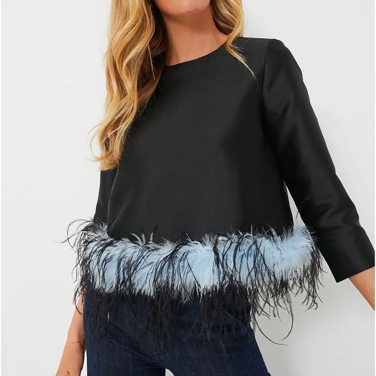 This Oh-So Chic Piece Is On The Top Of Our Lists! Perfect For A Girls Night Out, The Sabrina Blouse Features A Fun Feather Trim, Round Neckline, And Three-Quarter Length Sleeves. A Simple Black Silhouette With A Flirty Detail, We Are Styling This Wardrobe Winner With Black Pants And Heels For An Electric Ensemble. Round Neckline Three-Quarter Length Sleeves Back Zip Feather Trimmed Hemline Slightly Cropped Lined Material: 100% Polyester, Lining: 97% Polyester, 3% Spandex Care: Dry Clean Only **A Ruffle Collar Blouse, Tulip Sleeve, Feather Trim, Black Silhouette, Trim Top, Floral Tunic, Ruffled Sleeve Top, Lace Ruffle, Puff Sleeve Top