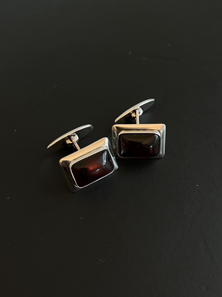 1950/60s sterling silver and amber cufflinks designed by Niels Erik From. Made in Denmark. Patina and wear as shown. Shipping on orders of multiple items will be combined whenever possible, and any overage greater than $5 CAD will be refunded to the buyer. Tie Tack, Tie Accessories, Greater Than, Suit And Tie, Cuff Links, Denmark, Halloween Shopping, Cufflinks, Patina