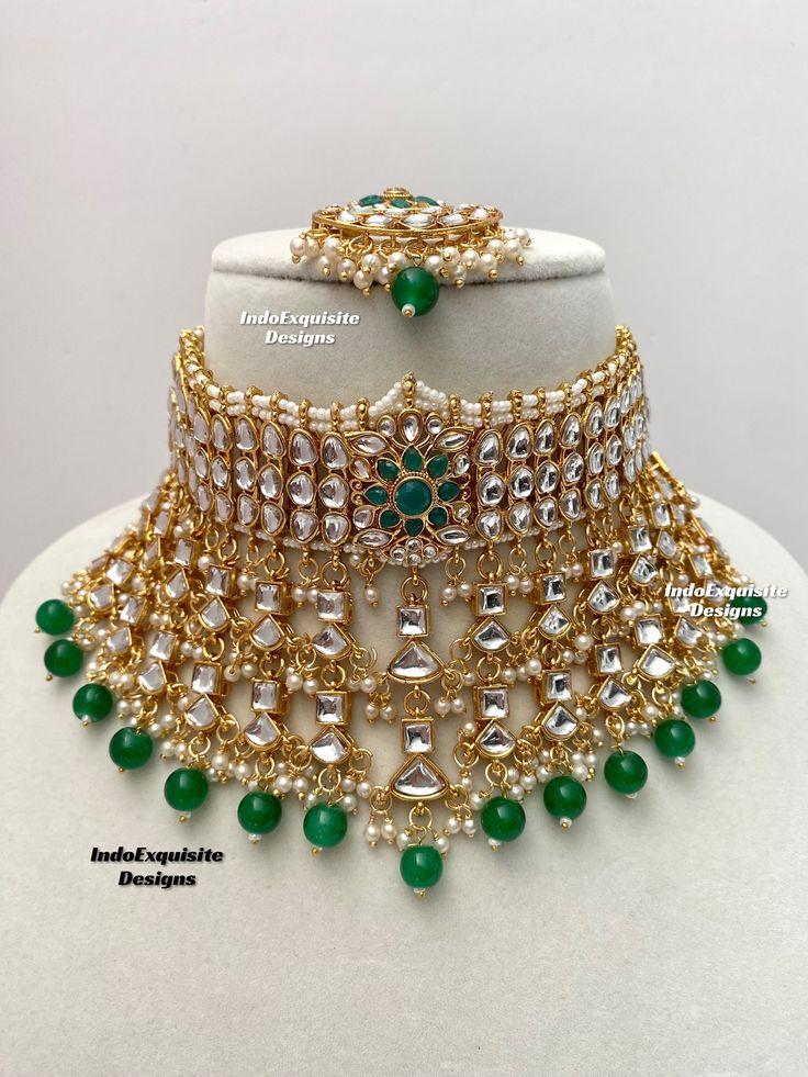 Elegant Kundan Choker comes with Jhumki Earrings and Tikka/ Indian Jewelry/Unique Polki and Kundan Jewelry/green color   All items are shipped from Brampton, Ontario, Canada. If you need your item by a certain day, please reach out to us for express delivery option before placing the order so that we can update the shipping for you. Standard shipping/delivery timeline Below are the delivery timeline estimates. We dispatch all orders by the next business day. ---> USA delivery timeline * 3-5 business days to major urban centers in USA. It may take 1-2 days extra to remote locations ---> Canada delivery timeline  * 2-3 business days - GTA  & Montreal  * 2-4  business days - Rest of Ontario/Quebec * 2-6 business days-  Rest of Canada    ---> Europe/Middle East timeline * 5-10 business days We Green Kundan Bridal Necklace Hand Set, Ceremonial Green Kundan Necklace, Green Meenakari Jewelry Sets For Ceremonial Occasions, Ceremonial Green Bridal Sets With Stone Work, Ceremonial Green Bridal Set With Stone Work, Green Kundan Choker For Wedding, Ceremonial Green Kundan Necklace Hand Set, Ceremonial Green Kundan Bridal Sets, Heavy Green Kundan Necklace For Ceremonial