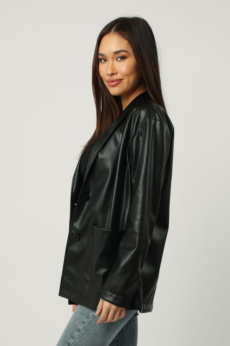 Blazer jacket long sleeve with button closures, patch pockets in vegan leather body. Ever versatile, perfect blend of chic or formal! Solid color vegan leather on standard fit.Body length from HPS: 28", Sleeve length: 22 1/2", Bust: 40" (Size Small) 100% PU (VEGAN LEATHER) Dry clean only Imported Black Leather Jacket With Lapel Collar For Spring, Classic Leather Jacket With Faux Front Pockets, Sleek Leather Jacket With Pockets, Long Sleeve Faux Leather Blazer With Button Closure, Sleek Faux Leather Outerwear With Button Closure, Business Faux Leather Outerwear With Pockets, Business Outerwear With Pockets In Faux Leather, Business Outerwear In Faux Leather With Pockets, Sleek Leather Jacket With Pockets For Work