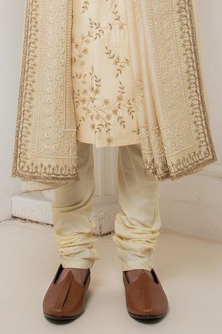 Beige raw silk sherwani with floral zardosi embroidery. Paired with a kurta and churidar. - Aza Fashions Eid Raw Silk Sherwani With Intricate Embroidery, Eid Sherwani With Intricate Embroidery In Raw Silk, Raw Silk Bandhgala With Resham Embroidery, Traditional Raw Silk Sherwani With Intricate Embroidery, Silk Sherwani With Straight Kurta For Wedding, Traditional Chikankari Embroidered Sherwani In Raw Silk, Silk Straight Kurta Sherwani For Wedding, Transitional Raw Silk Sherwani With Intricate Embroidery, Diwali Silk Sherwani With Dupatta