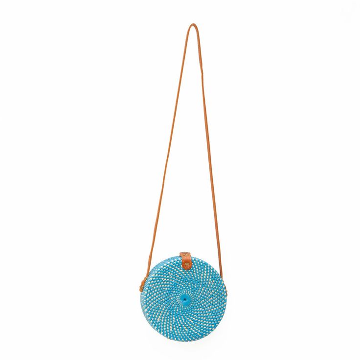 The Ata Bali is the must-have crossbody bag for all of your warm-weather events - from vacations to beach days. Keep your belongings secure with the Snap closure and the beautiful fabric-lined interior. Wipe Clean / Rattan Vacation Straw Crossbody Bag, Summer Travel Shoulder Bag With Single Strap, Crossbody Straw Bag With Adjustable Strap For Beach Season, Summer Vacation Bag With Single Shoulder Strap, Shoulder Bag For Summer Outings And Beach Season, Summer Vacation Shoulder Bag With Single Strap, Vacation Crossbody Shoulder Bag With Single Strap, Travel Straw Crossbody Bag For Beach Season, Travel Crossbody Straw Bag For Beach Season