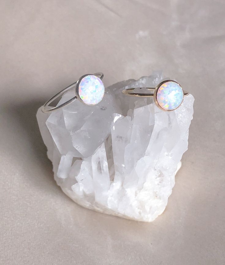 Delicate 14k Gold Filled or Sterling Silver Opal Ring is absolutely stunning with its reflects of violets, blues and pink. Opal is the birthstone for all our October born babes. ………………………………….DETAILS•STONE is Conflict Free Synthetic Opal, measuring 8mm •BAND is 14k Gold Filled or .935 Argentium Silver •WATERPROOF rings can be worn all-day •SIZE INCLUSIVE and made to order Don't know your ring size? Ring Size Guide or Buy Ring Sizer October Born, Sterling Silver Opal Ring, October Birthstone Rings, Silver Opal Ring, Opal Ring Gold, Gold Gemstone Ring, Crystal Healing Bracelets, Synthetic Opal, Gold Filled Ring