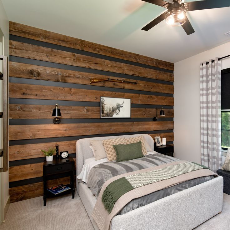 a bedroom with wood paneling on the wall