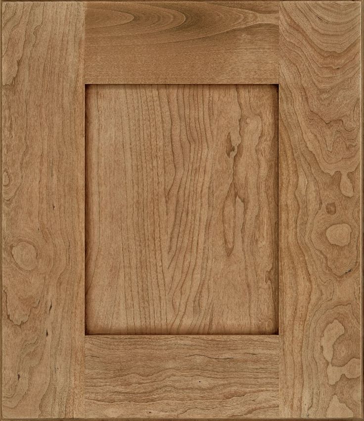 an unfinished wood paneled door with square design