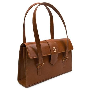 Aida Handbag in Tan/Brown This grand and capacious bag is one of Launer's newer designs. Practical, beautiful, and wonderfully Launer, this piece is an emerging favorite. Suitable for both professional engagements and daywear, this piece is a wonderful, versatile investment. Each of these soft leather handbags is made-to-order, following the exacting standards of the client. The leather is imported from Italy and only butter-soft, unblemished hides are chosen by their leather buyer. Every piece Designer Handheld Business Shoulder Bag, Timeless Flap Bag For Daily Use, Designer Shoulder Bag With Top Carry Handle For Office, Timeless Brown Shoulder Bag With Handle Drop, Timeless Calf Leather Shoulder Satchel, Timeless Calf Leather Flap Bag For Everyday, Designer Double Handle Flap Bag For Office, Elegant Leather Shoulder Bag With Handle Drop, Timeless Calf Leather Shoulder Bag For Business