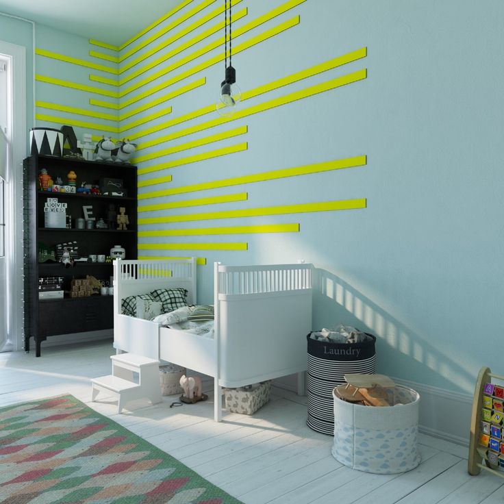 a child's room with yellow sticks on the wall