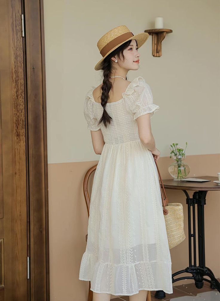 A white midi dress that goes perfectly with your favorite corsets but also detailed enough to wear alone. With its short puff sleeves with frills, square neckline, faux button front bodice, basque waistline, tiered midi skirt and lace broderie fabric, this dress is a staple for your cottagecore wardrobe. Stretchy smocked back. Lined. S: 29"-39" chest, 25"-35" waist, 43" lengthM: 30"-40" chest, 26"-36" waist, 43" lengthL: 31"-41" chest, 27"-37" waist, 43" length Summer Tea Length Corset Dress, Puff Sleeve Midi Dress With Ruffles, Fitted Prairie Dress With Ruffles And Short Sleeves, Elegant Short Sleeve Corset Dress With Ruffles, Elegant Corset Dress With Ruffles And Short Sleeves, Short Sleeve Midi Dress With Ruffles And Fitted Bodice, Short Sleeve Prairie Dress With Ruffles For Garden Party, Beige Puff Sleeve Dress With Ruffles For Summer, Fitted Bodice Midi Dress With Ruffles And Short Sleeves