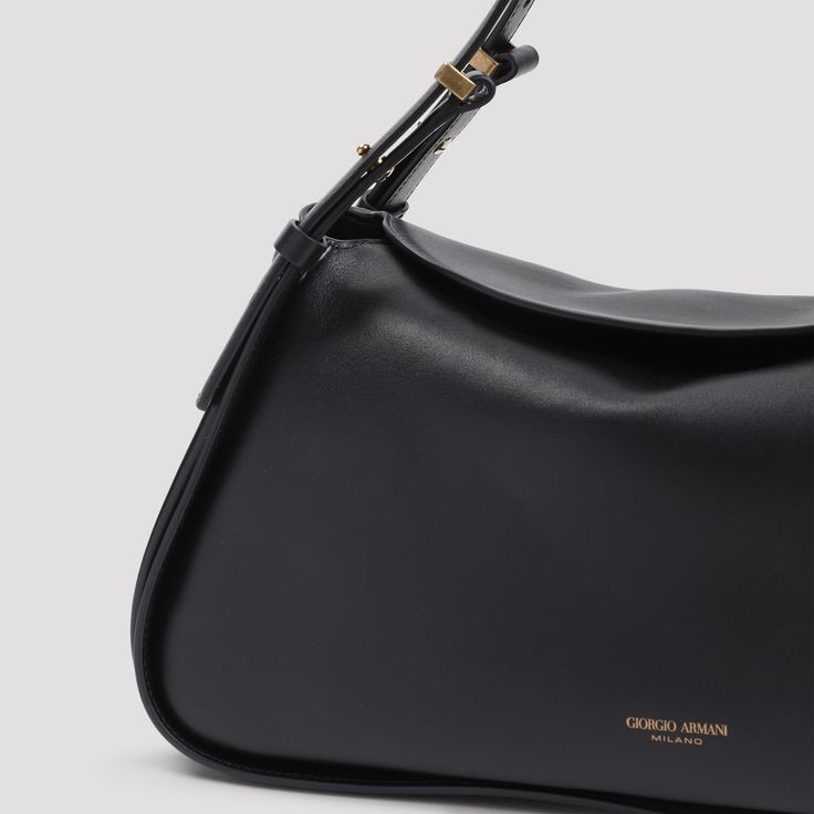 Giorgio Armani Black Calf Leather Handbag. Pure black calf leather handbag, top adjustable shoulder strap, top flap fastening, front gold-tone lettering logo, one main compartment, gold-tone hardware. Classic Rectangular Shoulder Bag With Logo Plaque, Classic Crossbody Shoulder Bag With Logo Plaque, Classic Top Handle Shoulder Bag With Gold-tone Logo Plaque, Classic Everyday Flap Bag With Gold-tone Logo Plaque, Chic Business Shoulder Bag With Gold-tone Logo, Modern Business Shoulder Bag With Gold-tone Logo Plaque, Classic Evening Flap Bag With Logo Hardware, Classic Leather Shoulder Bag With Logo Plaque, Classic Top Handle Bags With Gold-tone Logo