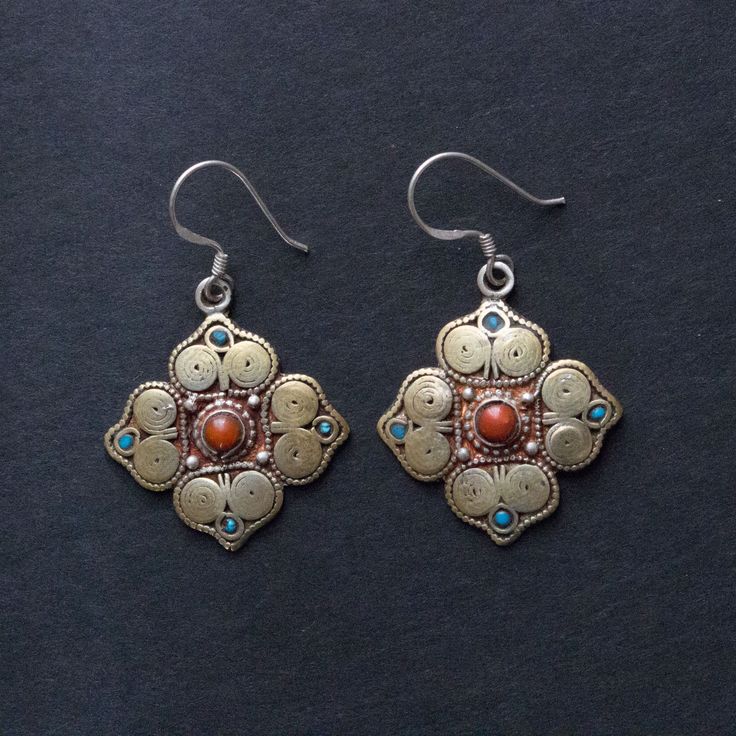 Handcrafted combination of sterling silver and brass filigree in a Mandala design Choices of either coral or turquoise Length 1.5" x 1.0" Ornate Ceremonial Drop Earrings, Metal Earrings With Intricate Design For Festivals, Elegant Ceremonial Metal Earrings, Silver Pendant Earrings For Festivals, Adjustable Traditional Sterling Silver Jewelry, Adjustable Oxidized Metal Jewelry, Handmade Adjustable Antique Silver Jewelry, Traditional Antique Gold Brass Jewelry, Ceremonial Dangle Earrings