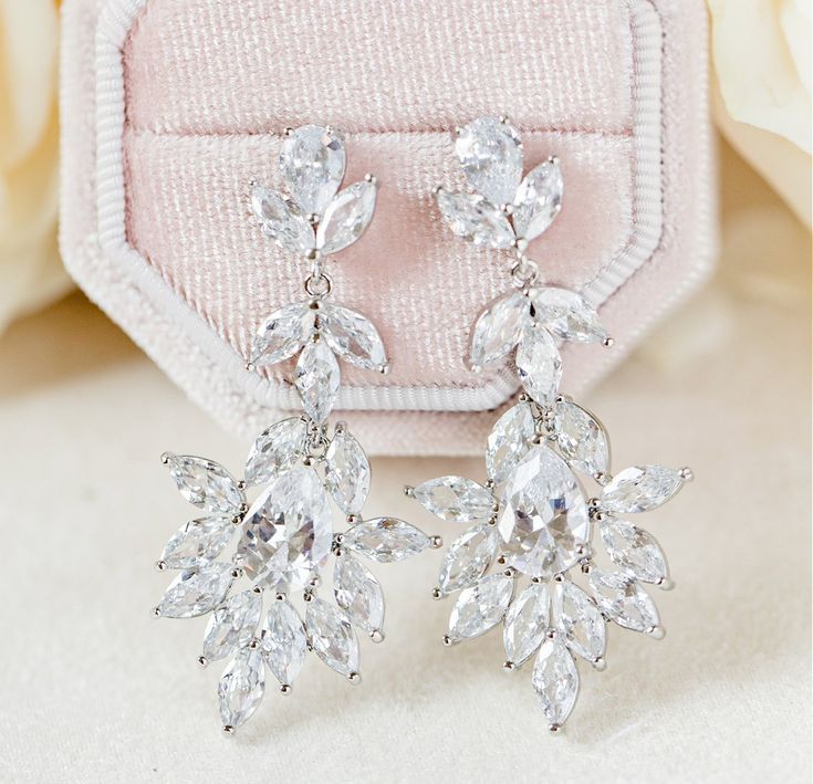 Desiree Drop Wedding Earrings | Wink of Pink Shop Glamorous Diamond Wedding Earrings, Glamorous Diamond Earrings For Wedding, Cluster Earrings With Diamond Accents For Wedding, Diamond Earrings With Sparkling Stones For Wedding, Glamorous Sterling Silver Wedding Chandelier Earrings, Glamorous Sterling Silver Chandelier Earrings For Wedding, Glamorous Wedding Diamond Earrings With Diamond Accents, Glamorous Diamond Earrings With Sparkling Stones For Wedding, Glamorous Wedding Diamond Earrings With Accents