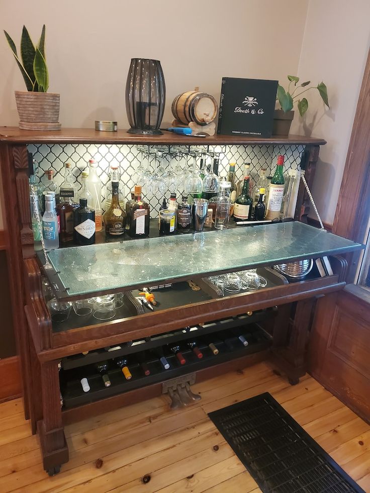 a bar with many bottles and glasses on it