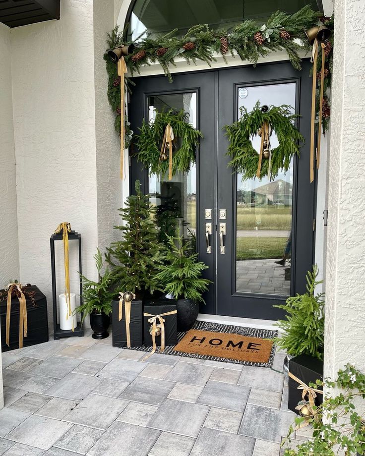 the front door is decorated for christmas with wreaths and pine cones on it's sides