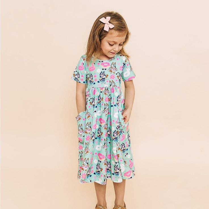 Bamboo Twirl Dress For Girls! Crafted With Eco-Friendly Bamboo Fabric, This Dress Offers Style And Sustainability. It’s Soft, Breathable, And Gentle On The Skin. With A Twirl-Worthy Design And Convenient Pockets, It's The Ideal Blend Of Fashion And Functionality. Shop Now For The Perfect Dress That's Kind To The Planet And Perfect For Your Little One's Adventures! Blue Twirl Dress For Spring Playwear, Casual Short Sleeve Twirl Dress For Dress-up, Summer Blue Twirl Dress For Playdate, Blue Spring Dress For Play, Blue Twirl Dress For Summer Playdate, Casual Blue Dress For Playtime, Casual Blue Dresses For Playtime, Blue Summer Twirl Dress For Playwear, Playful Blue Twirl Dress For Playwear