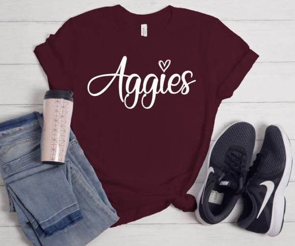 Aggies T-shirt is a great way to represent your school in style! Shirts are unisex sizes, size down for a more fitted look Casual Tops For College Events In Fall, Casual Fall Tops For College Events, Fitted School Spirit T-shirt With Letter Print, Fitted Pre-shrunk T-shirt For College, Casual Screen Print Tops For College, Casual Screen Print Tops For College Events, Casual Shirt With Letter Print For College Events, Fitted T-shirt With Letter Print For School Spirit, Casual Cotton Shirt For College Events