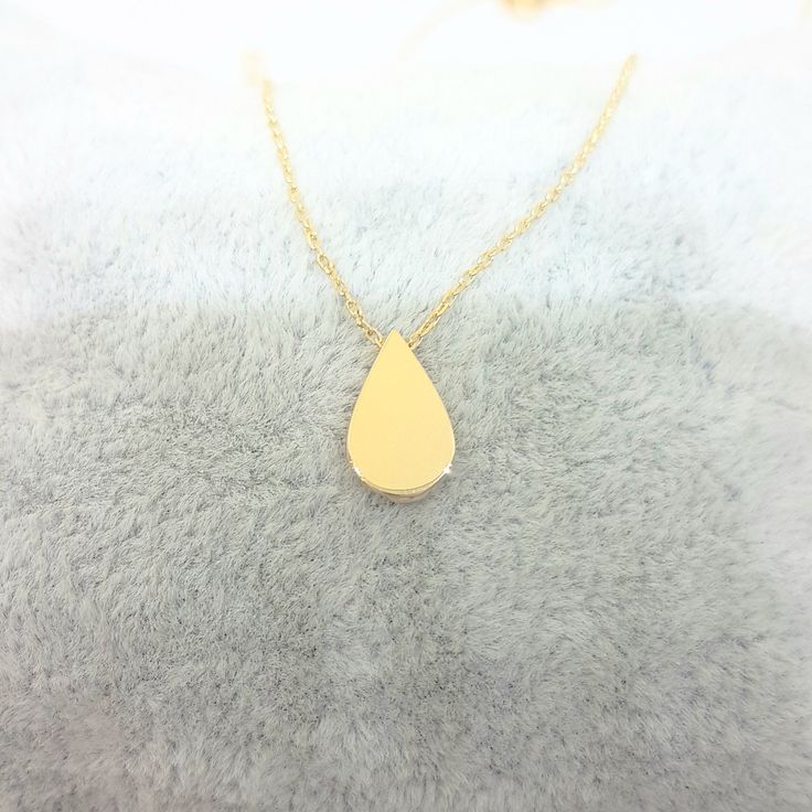 -The tear drop design women jewelry pendant necklace is made with high quality 14K real solid gold. - We recommend you to review our other bracelets and necklaces. We have listed many kinds of beautiful and trendy gold and silver products. You won't regret! https://www.etsy.com/shop/LatikaJewelryShop - This cute, charm, dainty, delicate, elegant, and trendy women jewelry pendant necklace has been artfully designed for timeless yet modern millennial fashion. and you can order in three different c Millennial Fashion, Snowflake Bracelet, Real Gold Chains, Millennials Fashion, Artfully Designed, Drop Pendant Necklace, Drop Design, Gold Gifts, Gold Heart Necklace