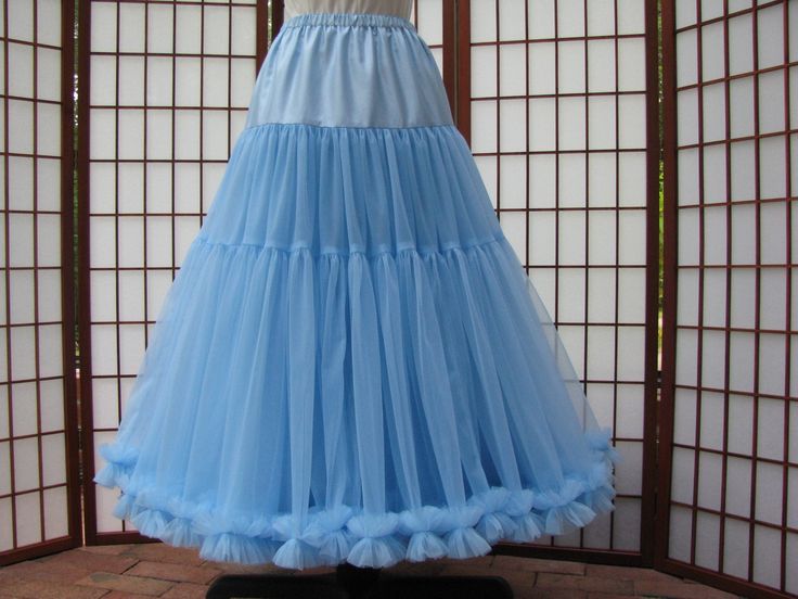 "This listing is for a custom order for a super-full double layer nylon chiffon petticoat with satin waist. If you like sultry swaying skirts, then this is the petticoat for you ;) The chiffon fabric hangs heavy so it causes this petticoat to drape and flow during movement. The pictured petticoat was designed for a 28\" (71cm) waist, 37\" (94cm) hips and is 33.5\" (85cm) long. It is displayed on a dress form with a 22\" (55cm) waist. You can choose any length you need. I will lengthen each of th Fitted Organza Skirt With Ruffles, Fitted Ruffled Petticoat For Evening, Fitted Gathered Petticoat For Costume Party, Fitted Petticoat With Gathered Skirt For Costume Party, Fitted Organza Tiered Skirt, Fitted Long Skirt Petticoat For Prom, Fitted Spring Petticoat With Can-can, Fitted Full Tulle Skirt Petticoat, Fitted Full Tulle Petticoat