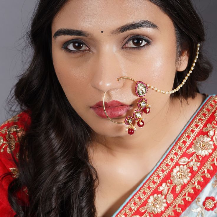 Elevate your bridal look with our Kundan Crystal Nose Ring- intricately handcrafted for a touch of Bollywood glamour. Gold plating and a delicate hair chain add a regal touch to this non-piercing nose accessory. Perfect for women looking for a tasteful addition to their Indian jewelry collection. Each pack contains 1 NathMATERIAL - Alloy Metal with Gold PlatingDIMENSIONS - Chain: 10 Inches Long, Nath: 2.7 Inches WideGIFTING IDEA - Ideal for a Valentine’s Day, Birthday, or Anniversary gift, for s Bridal Nath, Bollywood Glamour, Hair Chain, Piercing Nose, Hair Chains, Bollywood Style, Nose Piercing, Bollywood Fashion, Indian Bridal