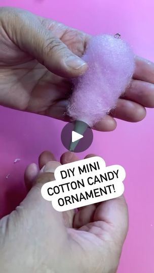 someone is holding cotton candy in their hand with the caption diy mini cotton candy ornament