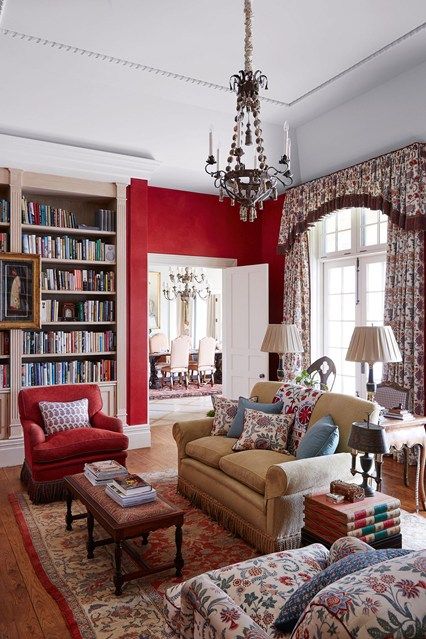 a living room filled with furniture and a chandelier