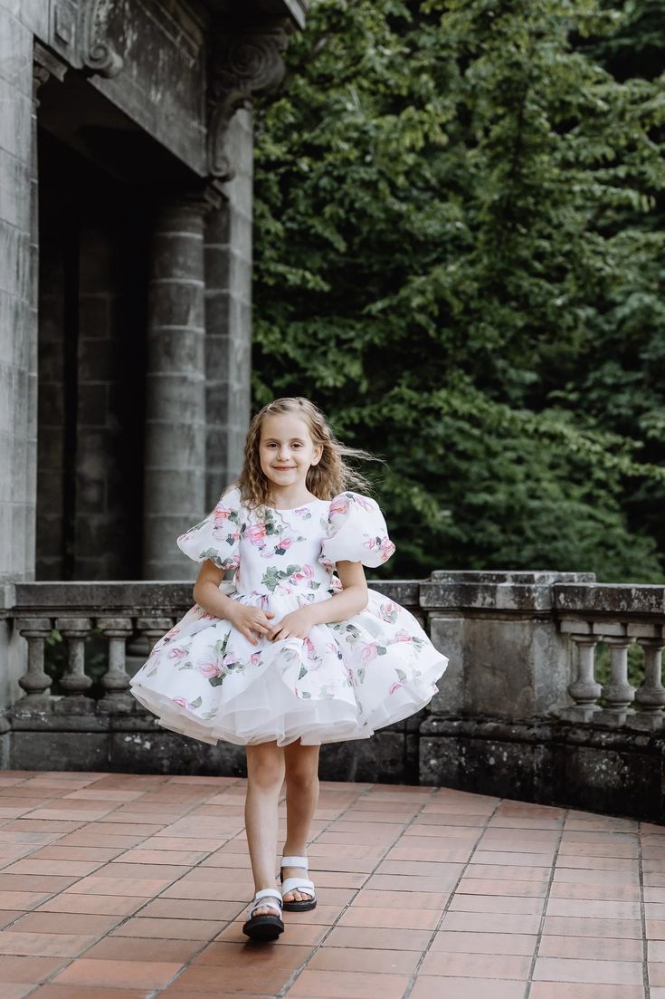 The adorable handmade Organza Print Foral Dress is full of tulle layers and lined in soft organic cotton for comfort. Your little princess will be the belle of the ball in this stunning twirl-ready floral gown featuring puff sleeves and a full skirt with ruffle mesh detail. Made in Europe. Bridal Collection. Floral Gown, Full Skirt, Little Princess, Bridal Collection, Floral Print Dress, First Look, Puff Sleeves, Baby Fashion, Floral Dress