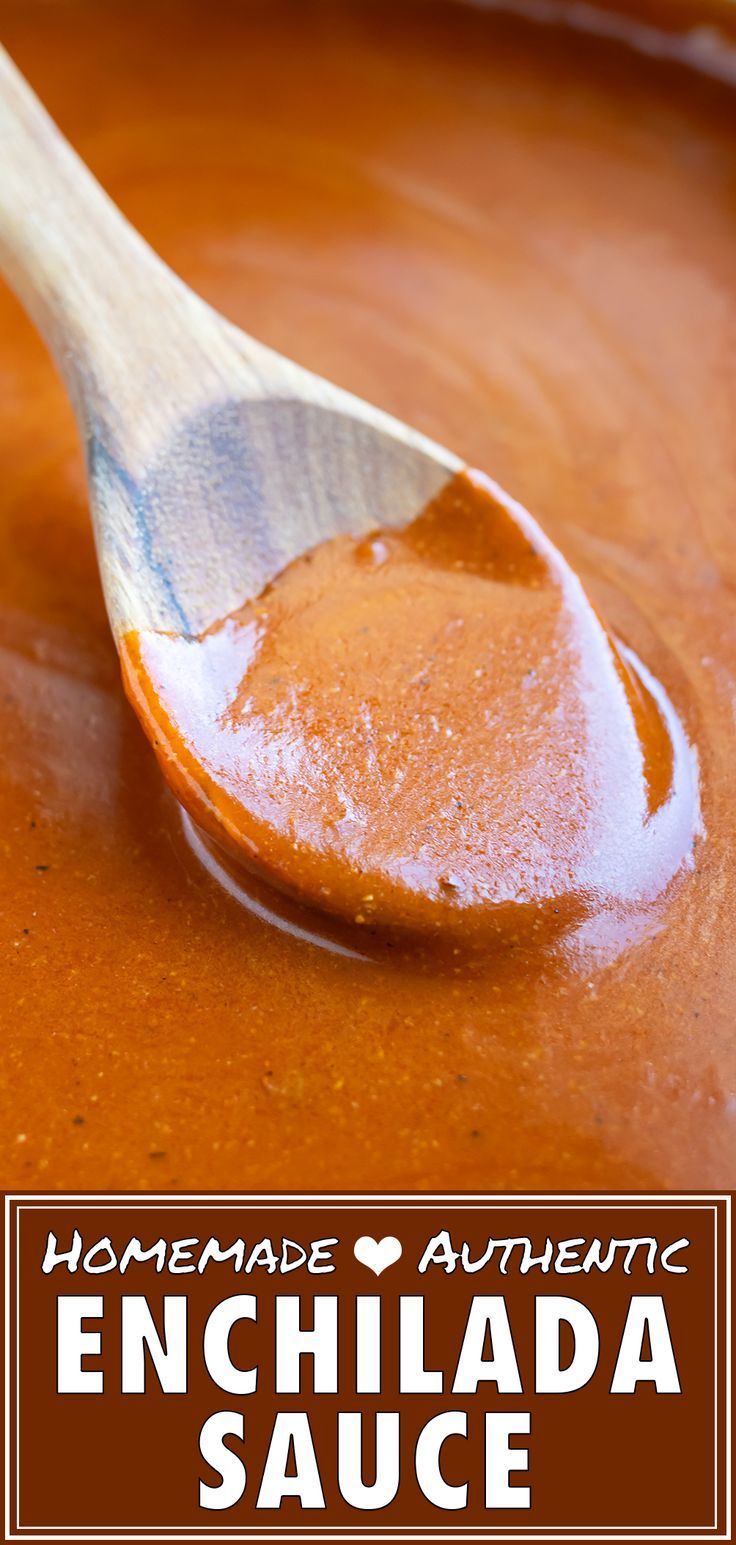 homemade authentic enchilada sauce in a bowl with a wooden spoon on top