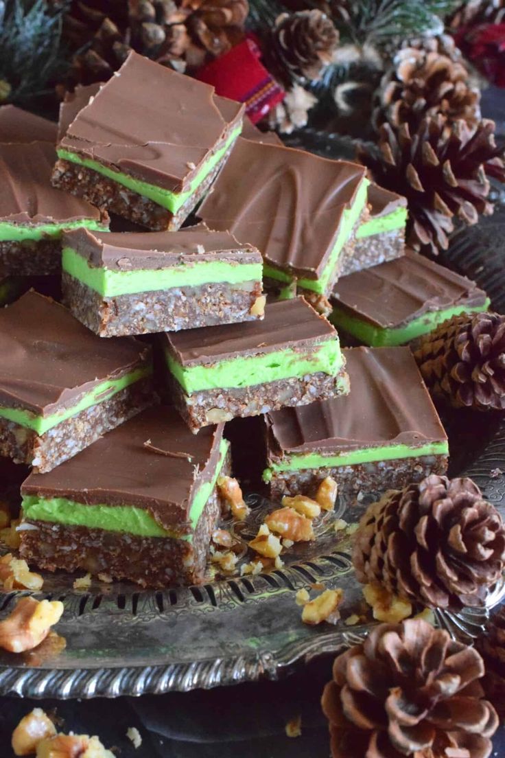 no bake mint squares stacked on top of each other with pine cones in the background