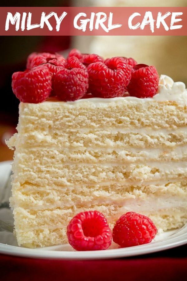 there is a piece of cake with raspberries on the top and white frosting