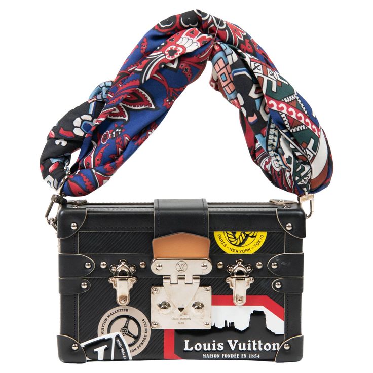 100% Authentic Inspired by their rich history of trunk making, the Louis Vuitton Petite Malle beautifully mixes the skilled craftsmanship of trunk construction with the effortless style of a modern day fashionista's crossbody bag. This adorable Malletage Petite Malle ("Mini Trunk") was a part of Louis Vuitton's World Tour line is apart of the Fall 2016 collection and features epi leather revamped with Nicolas Ghesquiere's take on vintage hotel stickers. It uses trunk construction, silver brass d Louis Vuitton Petite Malle, Vintage Hotel, Structured Shoulder, Louis Vuitton Limited Edition, Vintage Hotels, Nicolas Ghesquiere, Fall 2016, Lambskin Leather, World Tour