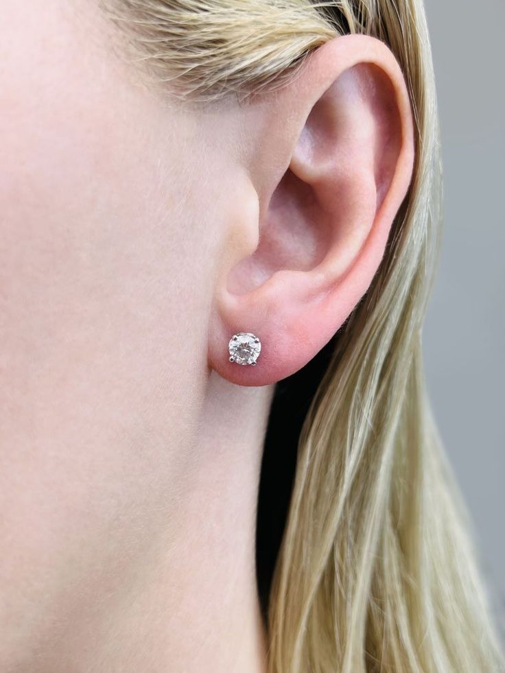 Enhance your elegance with our Tulip Diamond Stud Earrings, a unique blend of art and luxury. Crafted with precision, each earring showcases lab-created diamonds of F Color and VS clarity, ensuring both brilliance and purity. The highlight of these studs is their distinctive tulip-shaped design, which elegantly cradles two round cut, brilliant diamonds in a secure 4-prong setting. This intricate detailing not only adds a touch of nature-inspired beauty but also symbolizes growth and renewal. Available in a range of sizes from .32 carats to an impressive 2 Choose Your Total Carat Weight, these earrings are tailored to suit every preference. Choose from the timeless elegance of 18K white, yellow, rose gold, or the sleek sophistication of platinum to perfectly complement your individual style White Platinum Hallmarked Earrings, Platinum Hallmarked Earrings For Anniversary, Gia Certified White Gold Cluster Earrings For Formal Occasions, Gia Certified White Gold Cluster Earrings For Formal Events, Platinum Hallmarked Anniversary Earrings, Classic Diamond Cluster Earrings For Formal Events, Timeless Hallmarked Diamond Earrings For Formal Occasions, Classic Cluster Earrings In Diamond White For Formal Events, Classic Cluster Earrings In Diamond White For Formal Occasions