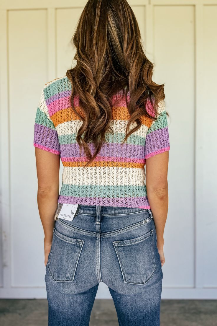 Add a pop of cheer to your wardrobe with our Happy Day Short Sleeve Knit Cardigan. The V neck and striped knit design make it a perfect piece for spring/summer. With a front button closure, you'll stay stylish and comfortable all day long. (It's like sunshine in a sweater.) Fits true to size 100% polyester Model is 5'10", is a 34D, dress size 4/5 and wearing a size small Striped Open Knit Summer Tops, Striped Open Knit Top For Summer, Striped Pointelle Knit Top For Summer, Casual Striped Pointelle Knit Sweater, Casual Striped Sweater For Day Out, Trendy Striped Knit Top For Spring, Striped Casual Summer Sweater, Summer Striped V-neck Sweater, Striped Textured Knit Top For Spring