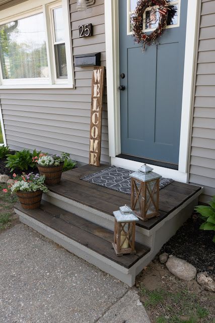 the front porch is decorated with flowers and candles