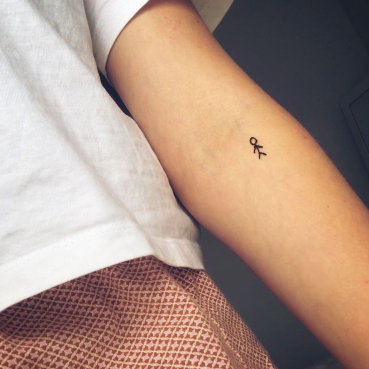 a person with a small tattoo on their arm