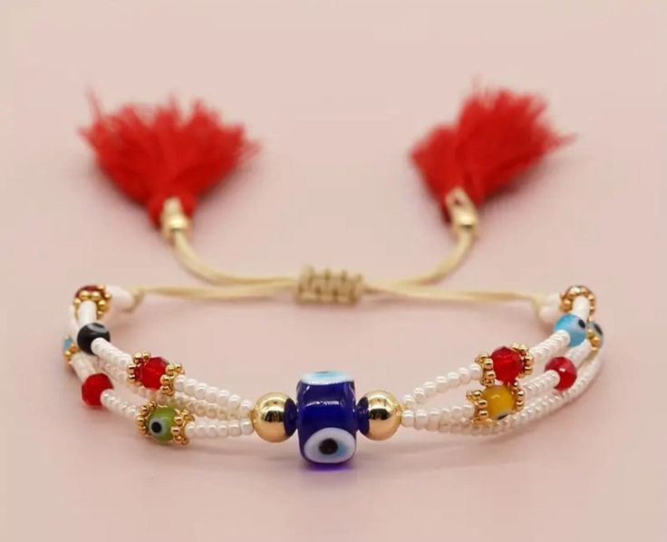 the bracelet is decorated with beads and charms