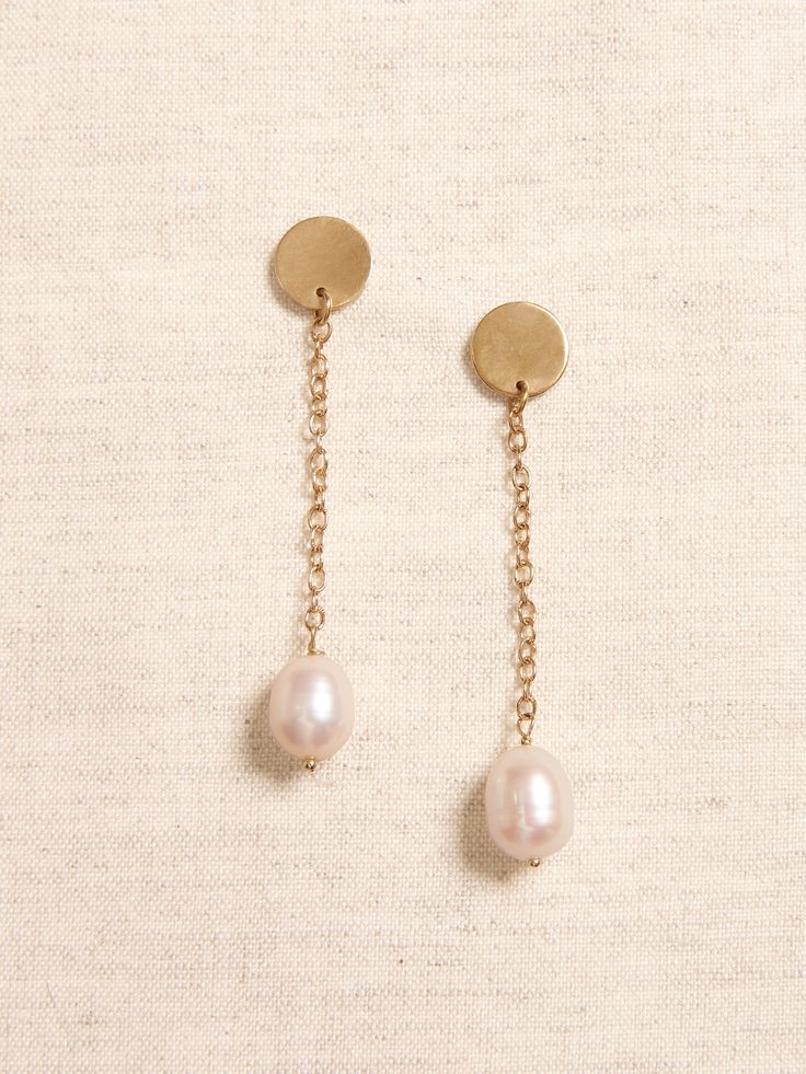 LUSTROUS PEARL COLLECTION: Every pearl is a natural wonder.  With their expansive variety of shapes, colorations, and sizes, our hand-crafted jewelry pairs gorgeous hand-picked pearls with brass or gold-plated brass chains and fittings for a collection of pieces that are perfect for any occasion.  Pretty white drop pearls dangle from delicate brass chains and small circular brass post earrings.  Sterling silver post backs.  Length: 2. 25" (5. 7cm) Pearl Collection, Crafted Jewelry, Pearl Chain, Pearl Size, Brass Chain, Chain Earrings, Earrings Sterling Silver, Hand Picked, Wedding Accessories