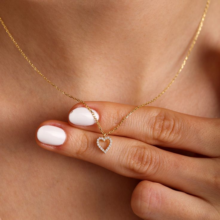 "The minimal heart design is substantial enough to be worn alone or layered with one of our necklaces.Wear as a dainty necklace as a pop to any outfit! This Beautiful dainty heart necklace can set anyone's heart aflutter. This simple yet elegant gold choker necklace will be hard to take off. The choker necklace is lightweight, delicate and minimal. This delicate heart necklace is perfect for everyday wear. Can be worn with any style of necklace to form a simple beauty. So treat yourself with a g Heart-shaped Necklace With Adjustable Chain For Birthday, Heart-shaped Charm Necklaces For Birthdays, Heart Shaped Charm Necklace For Birthday, Heart Necklace For Everyday Valentine's Day, Valentine's Day Everyday Heart Necklace, Heart Cut Necklace With Heart Charm For Birthday, Dainty Heart Charm Necklace For Birthday, Heart Charm Necklace For Birthday, Heart Shape Charm Necklace For Valentine's Day