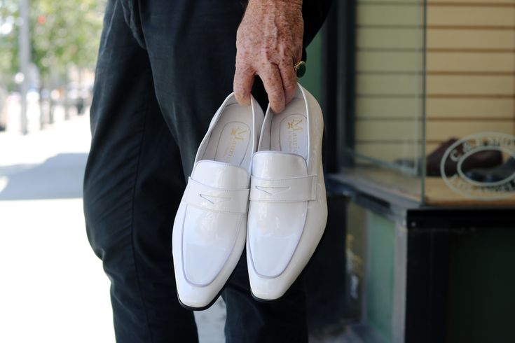 Elegant Fitted Slip-on Moccasins, Elegant White Leather Slip-ons, White Leather Slip-ons For Office, Elegant White Slip-ons For Office, White Pointed Toe Slip-ons For Work, Modern White Slip-ons For Work, Classic White Almond Toe Slip-ons, White Almond Toe Slip-ons For Business, White Slip-ons With Leather Sole And Plain Toe