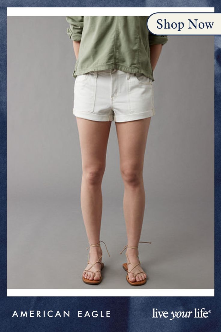 an advertisement for american eagle featuring a woman in white shorts and green shirt with her hands on her hips