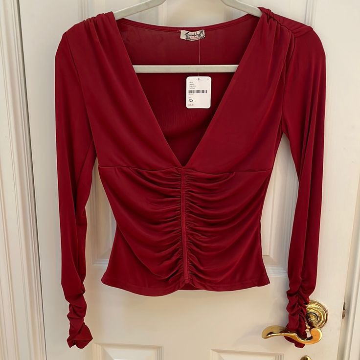 Flexible And Very Comfortable Material With Cinched Sleeves And Tastefully Low Cut Neckline. Brand New With Tags Red Stretch Top For Date Night, Stretch Red Top For Date Night, Fitted Ruched Red Blouse, Red Long Sleeve Tops For Night Out, Low Cut Top, Cut Top, Red Shirt, Low Cut, Free People Tops