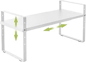 a white desk with two green arrows pointing to it