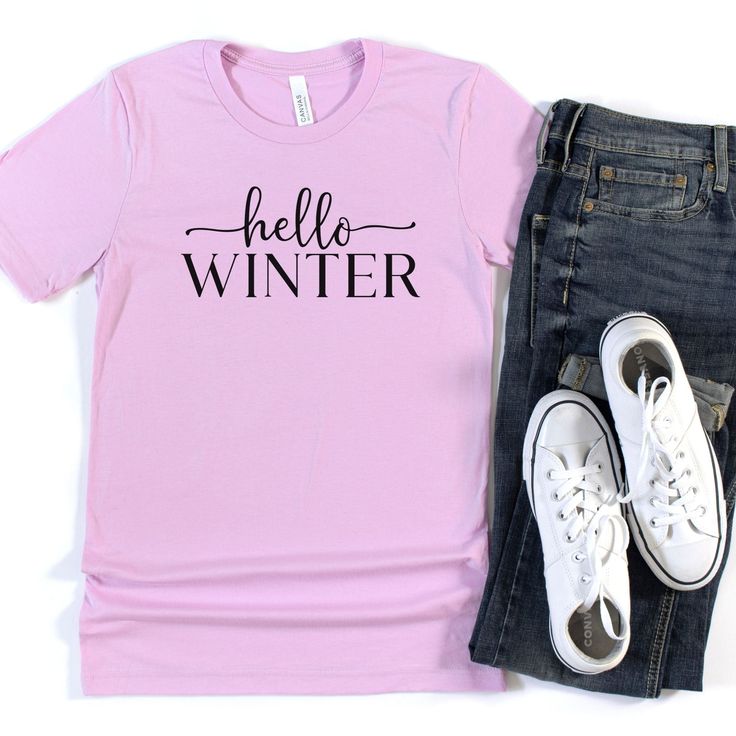 This Hello Winter tee is a perfect way to show your love for all things winter! Wear this super soft and comfortable tee to the coffee shop for your favorite drink, sitting by the firplace, or apres ski! Would be so cute styled with a long skirt to dress it up! Material: 52% Airlume Combed and Ringspun Cotton + 48% Polyester Care: Wash inside out on delicate with cold water. Hang to dry, or tumble dry on low. Cool iron if needed. Do not iron directly on the design. Sizing: This t-shirt is unisex Trendy Graphic Print Winter T-shirt, Trendy Comfortable Winter Tops, Trendy Winter Tops With Comfortable Fit, Trendy Comfortable Fit Tops For Winter, Trendy Winter T-shirt, Winter Short Sleeve Tops With Letter Print, Winter Crew Neck T-shirt Relaxed Fit, Comfortable Graphic Print Winter Tops, Short Sleeve Tops With Letter Print For Winter