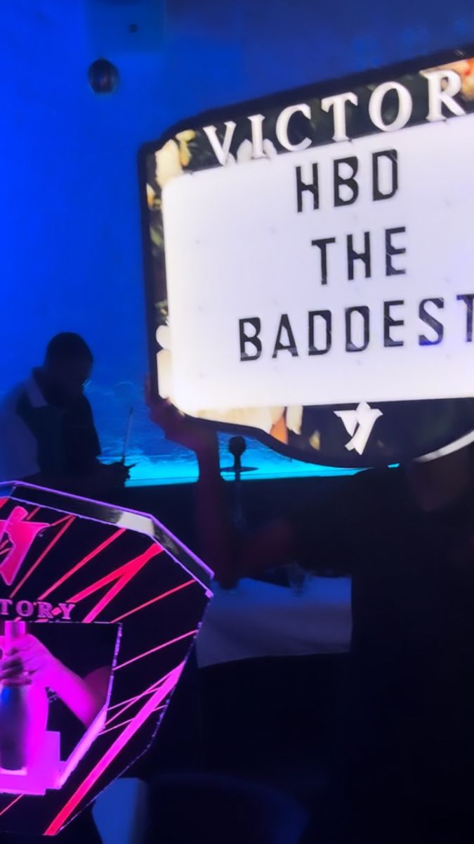 a person holding up a sign that says victoria hbo the baddest